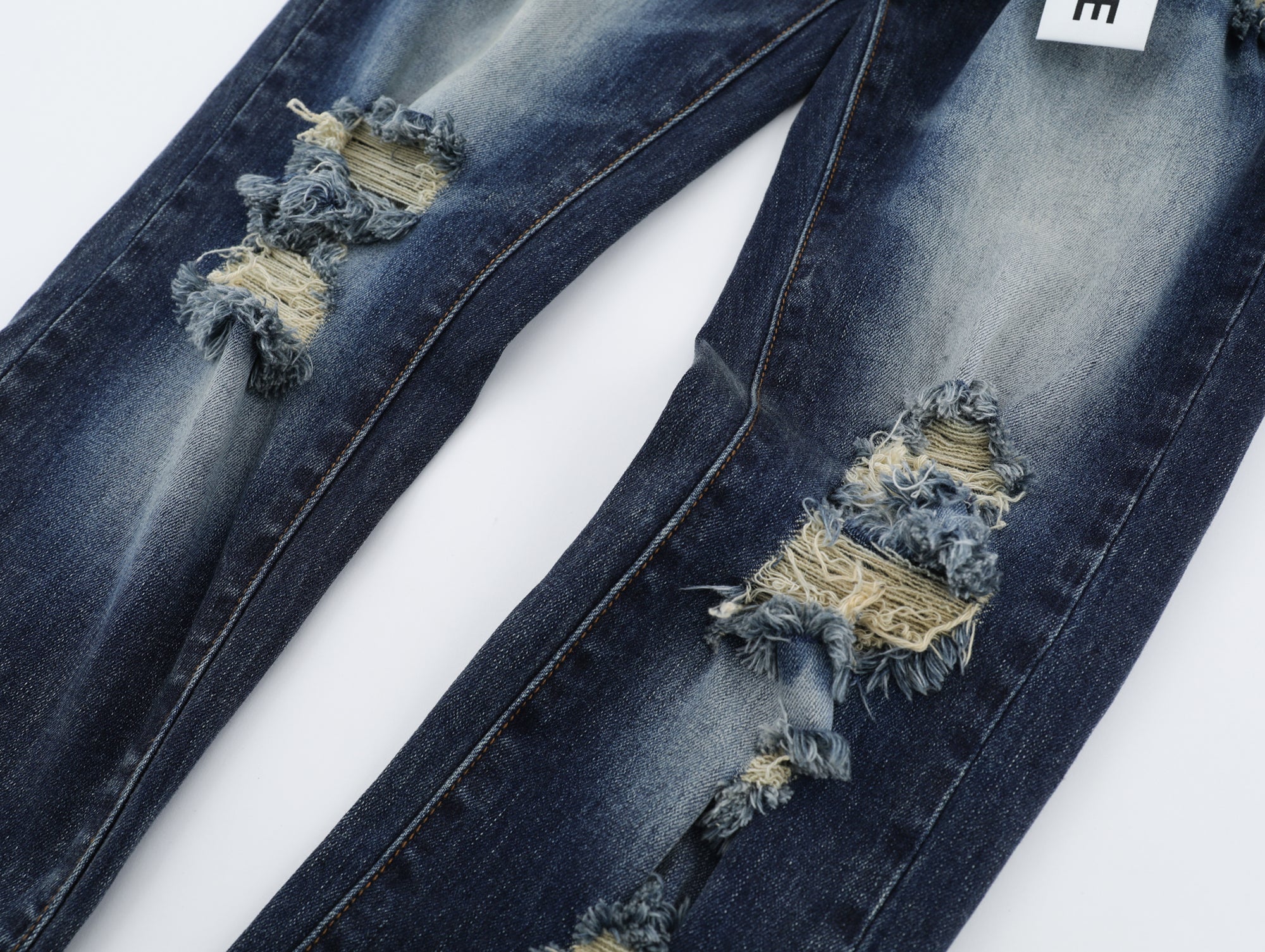 P125 Ripped Denim Jeans